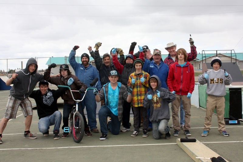 Skate park warriors: A team including young skate board enthusiasts, Recreation Department staff and Barrhead Mayor Gerry St. Pierre painted the Skate Park equipment black on 