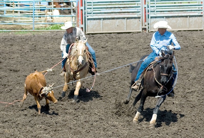 Larry Adams (left) and Leonard Schmidt roped themselves a calf at last year &#8216;s Senior Pro Rodeo, action sure to be matched at this year &#8216;s event June 16 and 17.