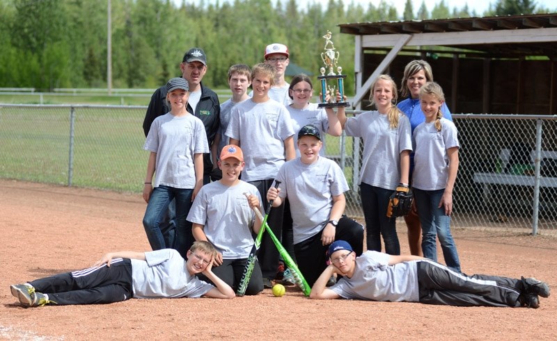 Neerlandia #1, winners of the tournament, hold their trophy after the final game June 7. Back Row: Coach: Barry Strydhorst, Luke Moes, Tyrone Kippers, Julia VandeRiet, Alyssa 