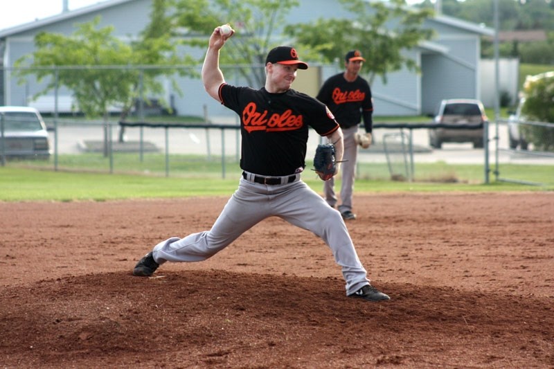 Barrhead Orioles pitcher Craig Connelly prepares to release a pitch during senior AA men &#8216;s NCABL action on Wednesday, June 25, 2014.