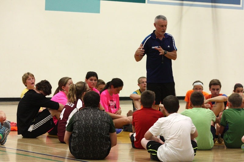 Chris Nicol gives the players some positive reinforcement.