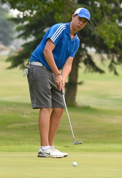 Peyton Measures, who was partnered with Charles Hartt, makes a putt. The team claimed first place in the tournament, making Hartt winner a winner in 2013 and 2014.