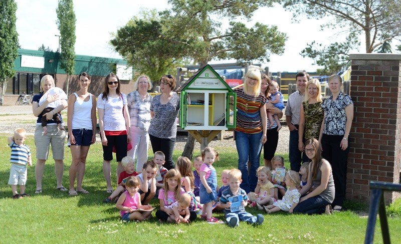 Parents and children from the Moms and Tots program celebrated the opening of another Little Free Library (LF) with Communities for Children coalition members last week. The