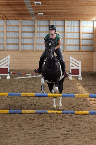 Mariah Wierenga on Skunk completes one of her jumps.