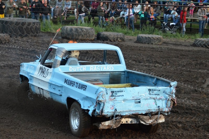 Marlo Mast drives off into the sunset after winning the third truck heat during the demolition derby.
