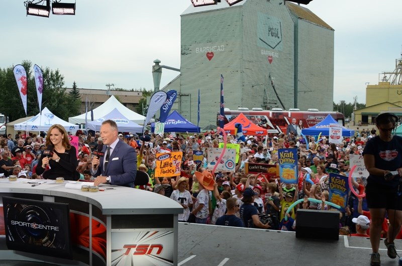 TSN SportsCentre anchors Kate Beirness (left) and Darren Dutchyshen hosted a live broadcast from Barrhead on Monday, August 18. The backdrop for the telecast was a sea of