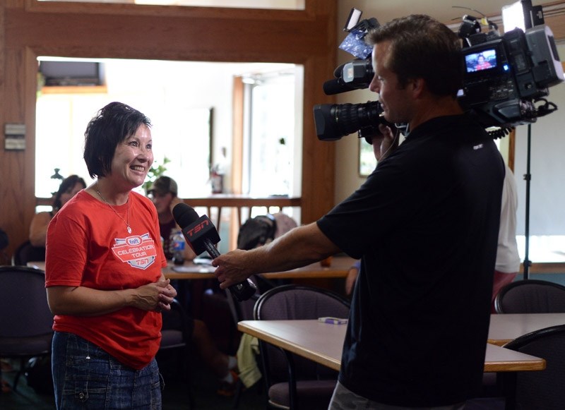 Kraft Celebration Tour local organizing committee chair Patty Storseth-Wierenga is interviewed by TSN after Barrhead was crowned 2014 Kraft Celebration Tour champion on