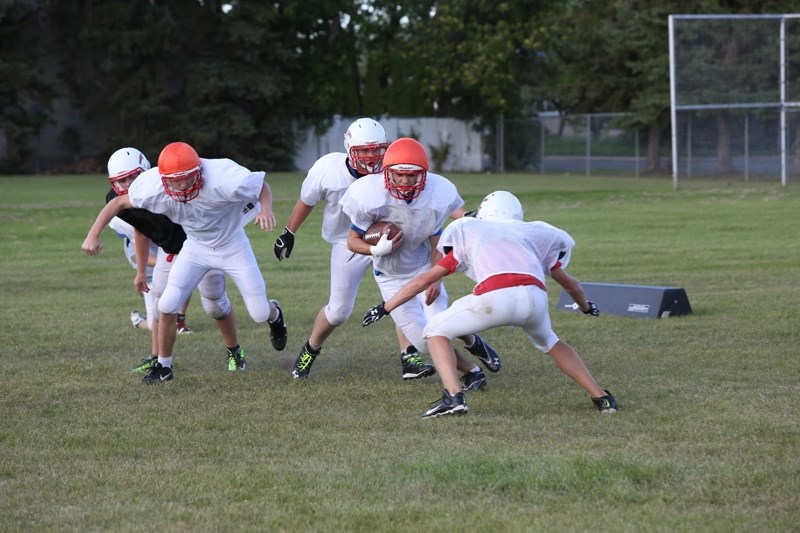 Jacob Kiselyk fights his way through the defence during a punt cover drill at the Aug. 28 T-Birds practice at R.F. Staples in Westlock. The team opens its season Sept. 5 in