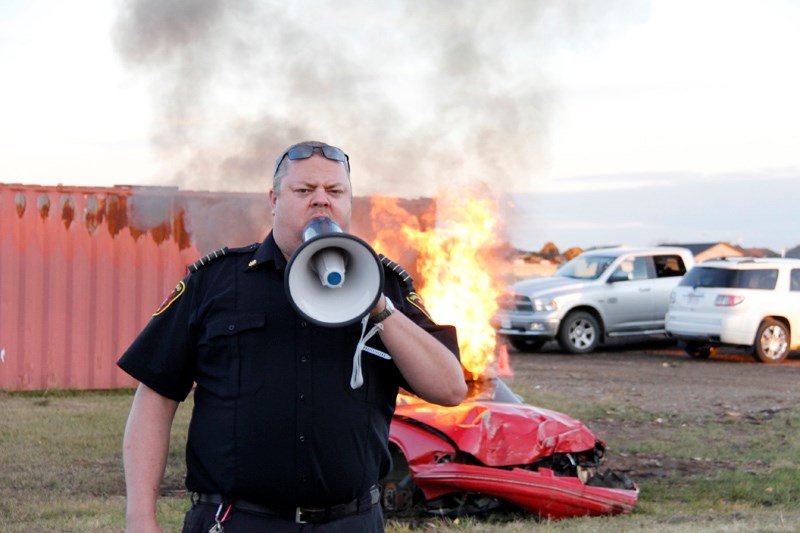 Fire Chief, John Whittaker asks the kids if the fire is big enough to call the firefighters, they respond with &#8216;no. &#8216;