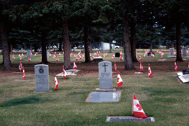 Canadian flags can be seen fluttering in the wind at the Barrhead Field of Honour. The Barrhead Royal Canadian Legion places a flag by the gravesite of the soldiers who