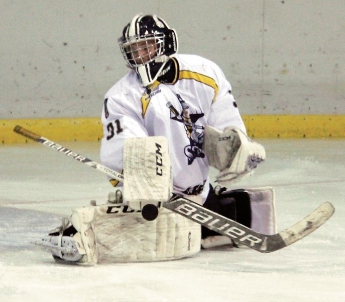 Logan Branden, Steelers goalie, watches the puck as he makes a save during a preseason home tiering game for this season in the 1660 league. It is still unclear as to whether 