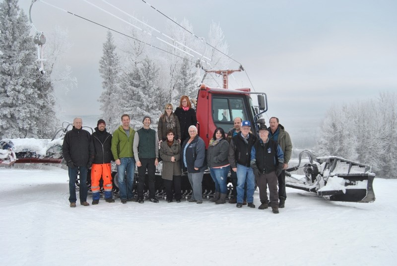 The board of Misty Ridge Ski Hill poses with their latest acquisition on Wednesday, Dec. 16.