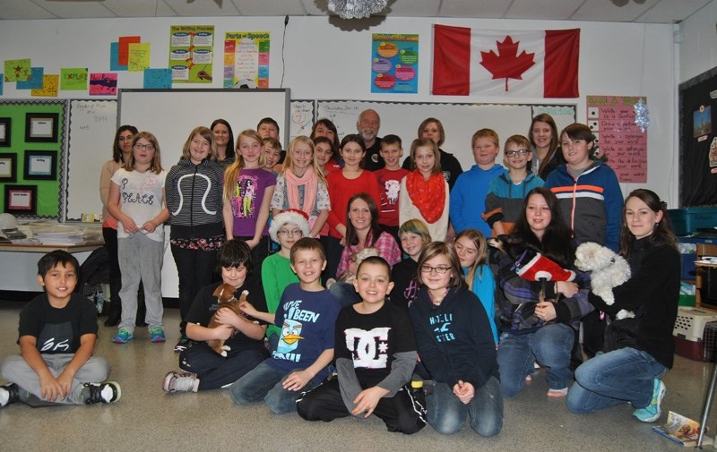 Jaime Fisher &#8216;s Grade 5 class pose with the some of the BARS volunteers.