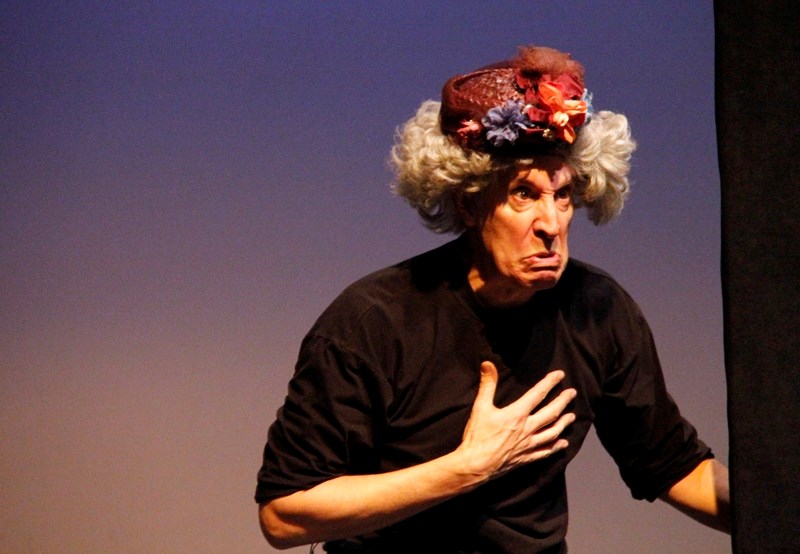 In this scene, Robert Posts dresses as the widow of a man who was found murdered, and stuffed.