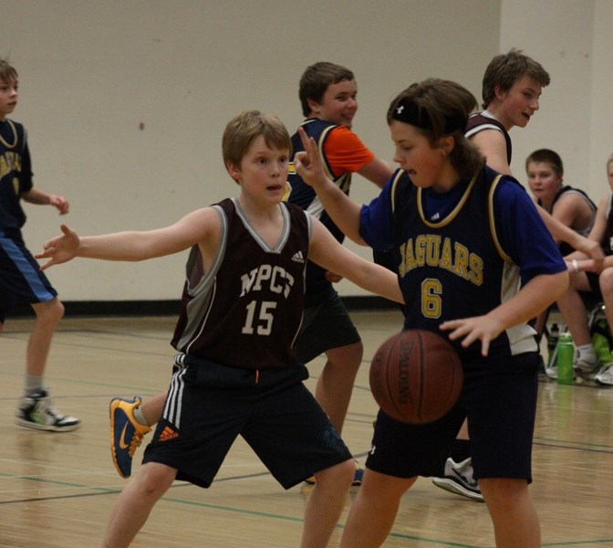 Barrhead Jaguar Owen Weeks slows down the play and directs his teammates in the Neerlandia zone.