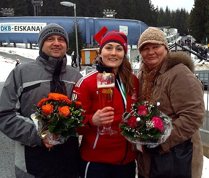 Melissa Lotholz poses with her parents after a World Cup race in Altenburg, Germany.