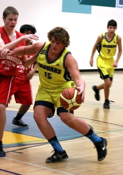 Tanner Whiting, of the Junior Jaguars, drives to the net in a game against Westlock. Although the Jaguars are a junior team they were able to defeat the Westlock Junior