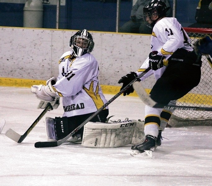 Barrhead Steelers goaltender, Logan Branden, looks for a rebound after making a save off his chest protecter during a playoff game against St. Albert on Jan. 28. Branden has