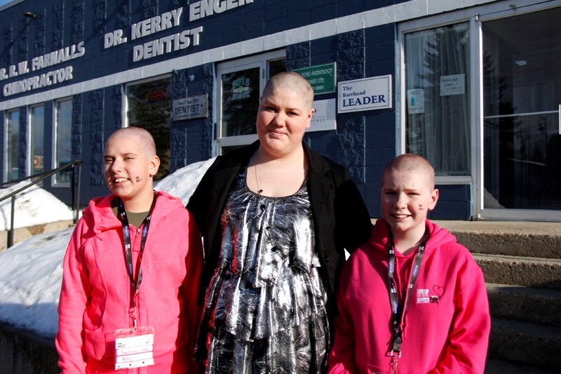 Three local girls spent their afternoon getting their heads shaved for cancer on Friday, Feb. 20, as they took part in the Hair Massacure. Jocelyn Liske, left, raised $851,