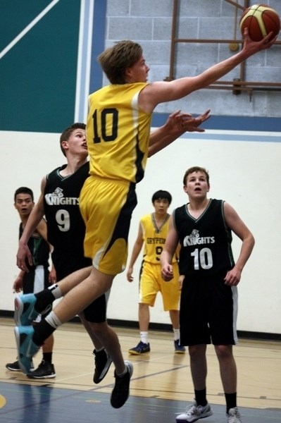 Barrhead Gryphon, Cole Knudsen, goes up for a layup in their opening game on Friday, Feb. 27 against the Lacombe Knights. Barrhead defeated the Knights by a score of 82 to 62.