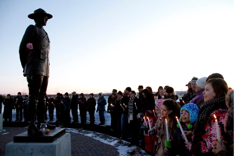 Hundreds gathered at the ceremony and joined in the singing of O &#8216;Canada.