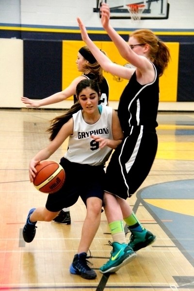 Tabitha Raju dodges past an Edwin Par player during their first game in zones on Friday, March 6. The girls trampled their opponents with a final score of 53-28.