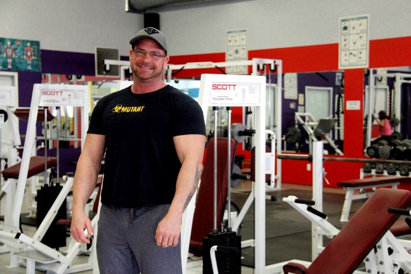 Vincent Wiese, owner of Vince &#8216;s Gym, stands proudly in the facility he and his wife built. The gym offers a variety of services.