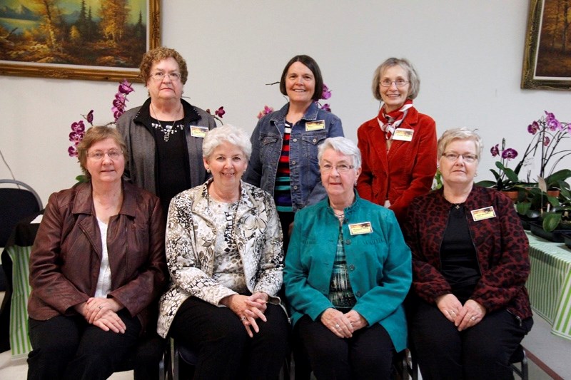 The Farm Women &#8216;s Day Committee hosted the event on Saturday, March 21. Back row left to right: Jean Haltiner, Marj Preugschas, and Audrey Sheild. Front row left to