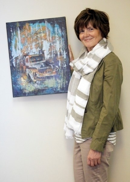 Jo Ann Nanninga stands with her piece &#8220;the sun sets on Fred&#8217;s treasures, &#8221; and will be showing her work during the Northern Zone Show in May.