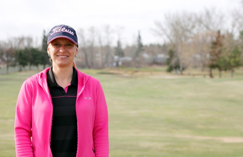 Mariet Kosterbok, proshop manager at Paddle River Golf Course, stands on the greens on Wednesday morning. The warm and sunny weather meant a busy first week for the course.