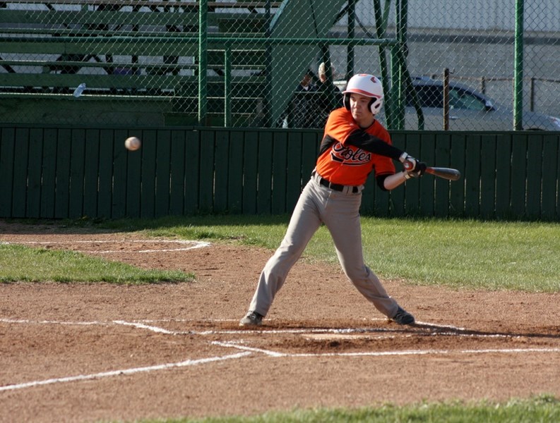 Darien Crye takes tries to make contact with a pitch in the strike zone.