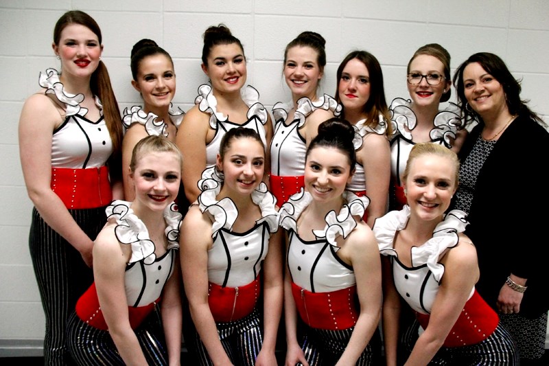 The tap group take a moment to pose for a photograph together prior to taking the stage during the Footworks Dance Academy 2015 Showcase on Friday, May 8. Instructor, and