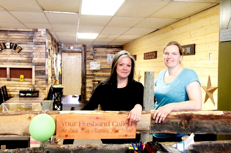 Laura Pederson, left, and Anja Donkers, right, stand in the Dandelion Bistro at the Wishing Well on opening day. The pair said they are hoping the Bistro becomes a place