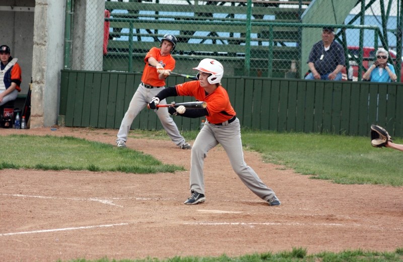 Logan Brandon hits a bunt RBI single in the fourth inning.