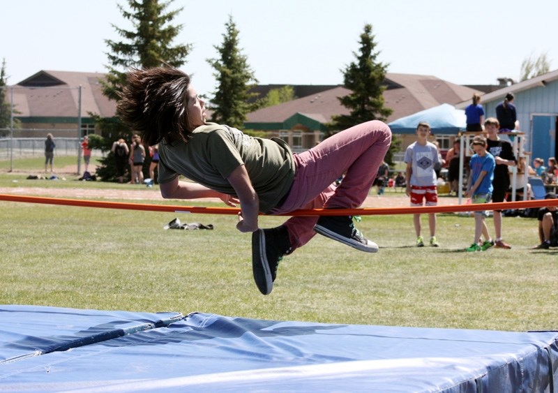 Dominic Alexander, Grade 7 clears the bar during Barrhead Composite High School &#8216;s Ron Pate Junior High School Track meet.