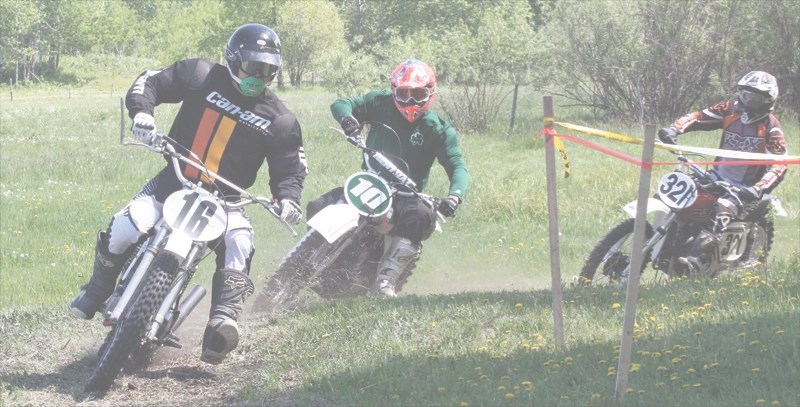 Vintage MX Alberta members (L-R) Brad Foster, Tony Paxton and Hugh McCourt round a corner at Barry &#8216;s Ultra Motorsports Park May 31 during a Vintage MX Alberta event.