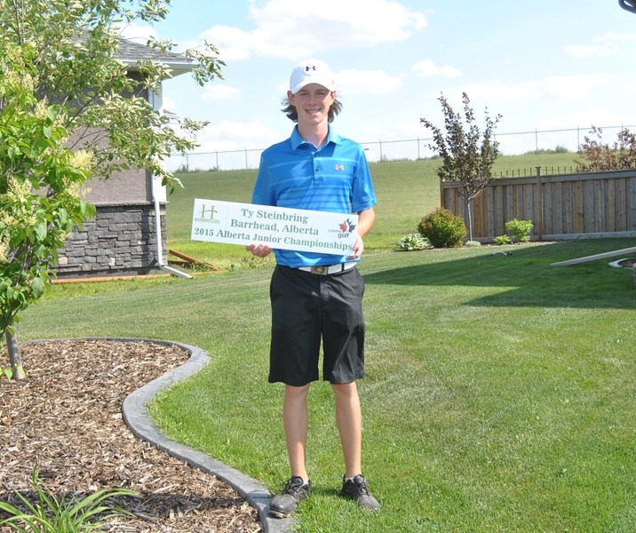 Ty Steinbring shows off his placard from the Alberta Provincial Junior and Juvenile Golf Championship.