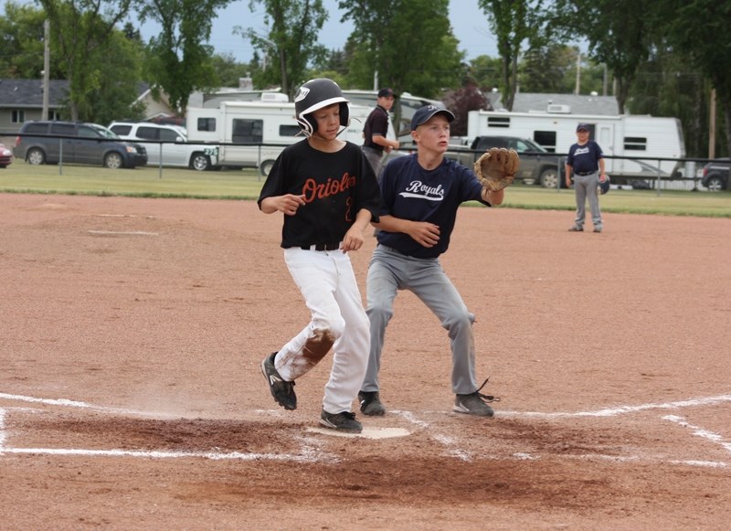 Barrhead Oriole Jayden Cramer crosses home plate during a game against a team from Coronation on Saturday, July 25. Cramer got to first base on a single, but reached home by
