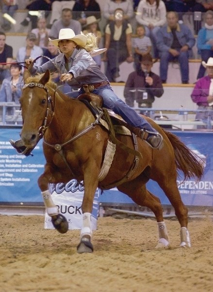 Taylor Schmidt races for the finish line in a women &#8216;s barrel racing heat during last year &#8216;s WRA Rodeo Finals.