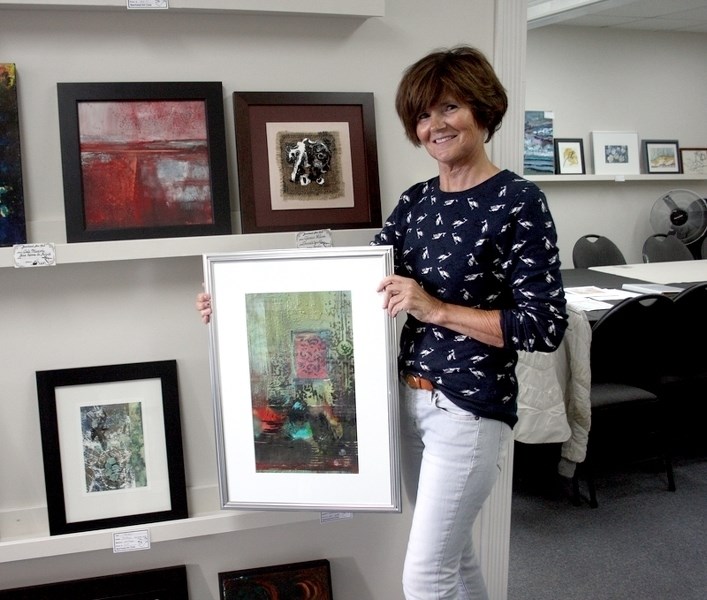 JoAnn Nanninga, president of the Barrhead Art Club, showed off her mixed media collage that will be part of the Abstract Show that starts on October 2. &#8220;I play around