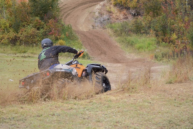 Cole Grossenbacher rounds the corner and gets ready to begin go on a two-kilometre trail ride in the bush.