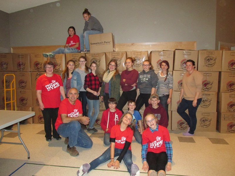 The Alliance Church Youth group helped prepare close to 900 boxes for transport on Friday, Nov. 20.