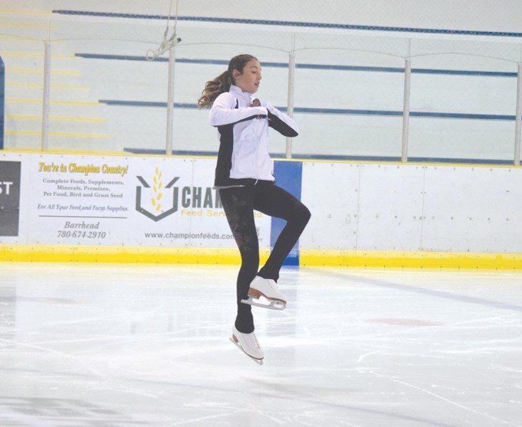 Emma Botros makes a single axel jump during figure skating practice on Oct. 9.