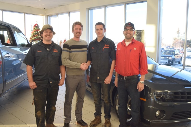 From left: James Haitel, owner of Haitel &#8216;s Garage, Tate McNelly, Grizzly Trail Motors general manager, Ray Barendregt, RAP student, and Dave Sawatzky, Barrhead and