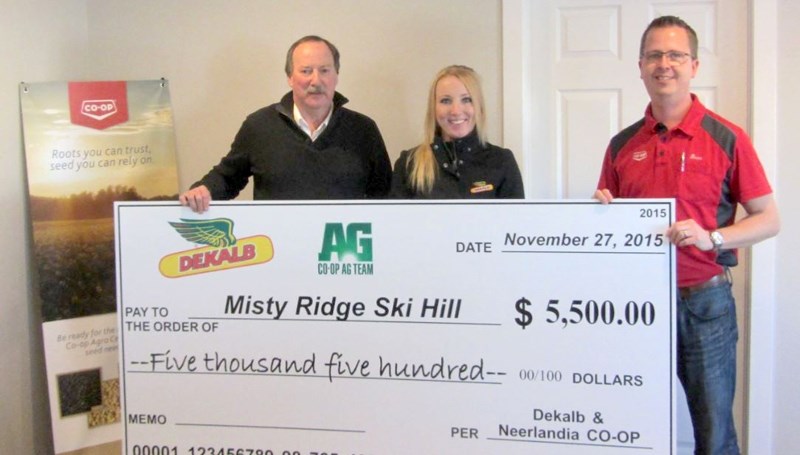On Monday, Nov. 30 Kerry McElroy, president of Misty Ridge Society, received $5,500 a donation from Natasha Keith from DECALB (m), and Steven DeVries, representing Neerlandia 