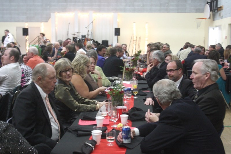 Town and County councillors share a table and conversation during the 1st Annual Fireman &#8216;s Ball, held at the Barrhead Elementary School on Dec. 5. (L to R) County