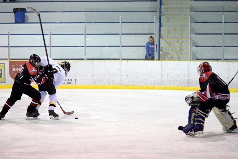 Siraj Assaf of the Barrhead Pirates powers past a New Serpeta defenceman for a shot on goal in the last round robin game of the tournament on Sunday, Dec. 13.