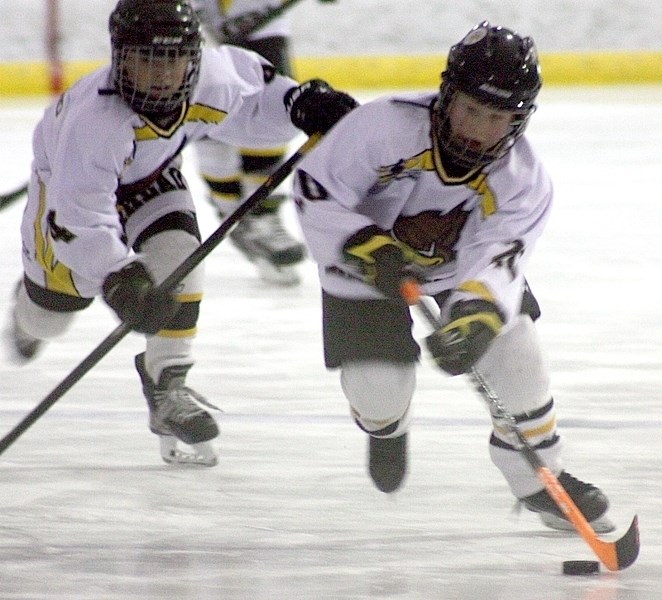 Alex Heimstra leads the charge with teammate Julian Sutherland in close pursuit, during one of Barrhead &#8216;s attempts on Westlock &#8216;s goal.