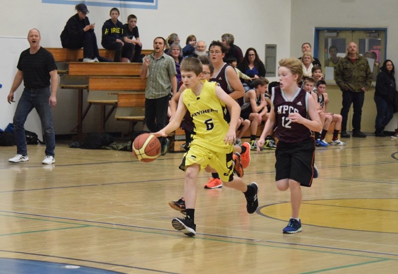 Barrhead Panther Brandan Bujold on a quick break being pursued by Nathan Vanderwekken.