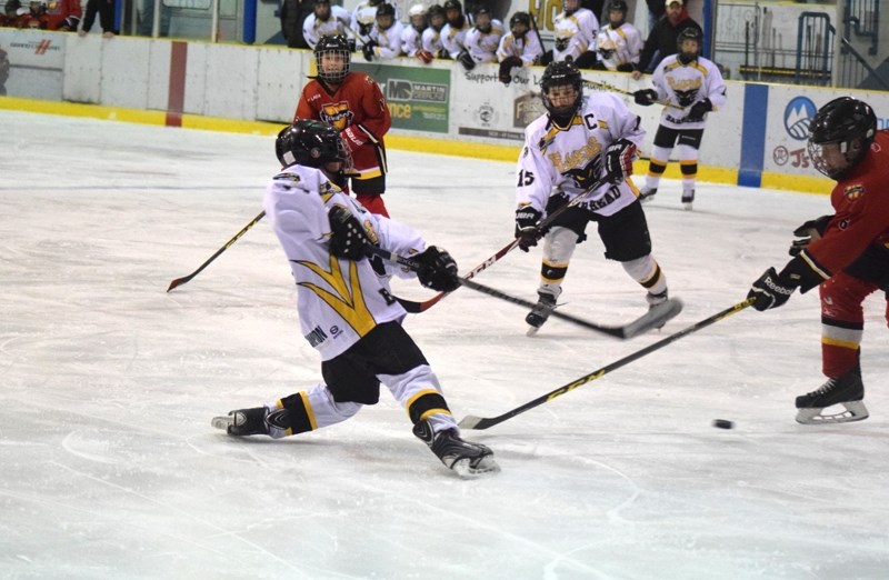 Barrhead Flyer Koby Miller takes an off balanced shot in the first period of the game. Miller ended the game with two goals.